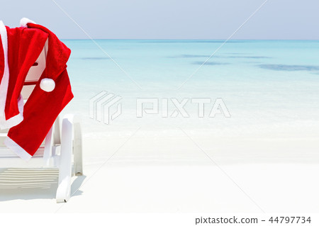 Santa Claus wear hanging on sun lounger 44797734