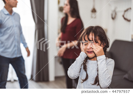 Little girl crying because of her parents quarreling. Girl abuse 44797937