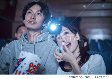Spectators watching a movie in a cinema 44799468