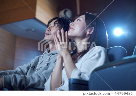 Spectators watching a movie in a cinema 44799485