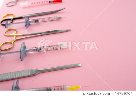Flat lay of medical instruments on rose background. Mock up health care medical background. 44799704