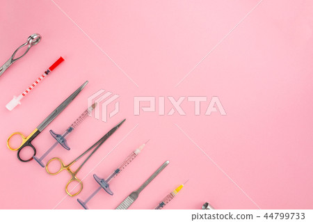 Flat lay of medical instruments on rose background. Mock up health care medical background. 44799733