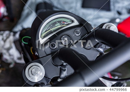 Cropped close up shot of beautiful and custom made motorcycle in the workshop 44799966