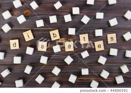 Diabetes Text On Sugar Cubes background Diabetes Text On Sugar Cubes background 44800391