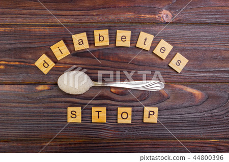 Diabetes STOP block wooden letters and sugar pile 44800396