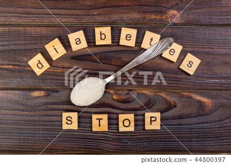 Diabetes STOP block wooden letters and sugar pile Diabetes STOP block wooden letters and sugar pile 44800397