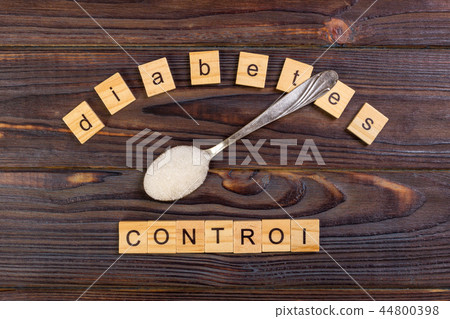 Diabetes control block wood letters and sugar pile Diabetes control block wood letters and sugar pile 44800398