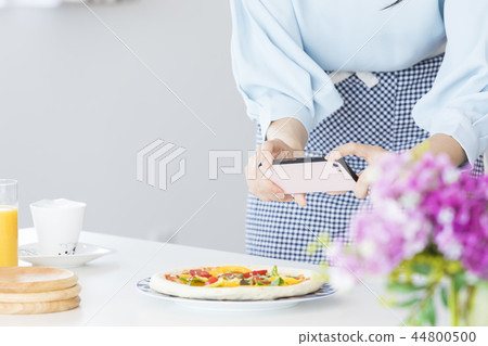 A woman shooting a dish A woman shooting a dish 44800500