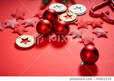 christmas baubles, stars and decorations on a red background christmas baubles, stars and decorations on a red background 44802150