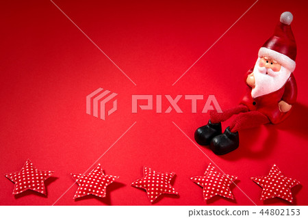 santa claus figurine on a red background santa claus figurine on a red background 44802153