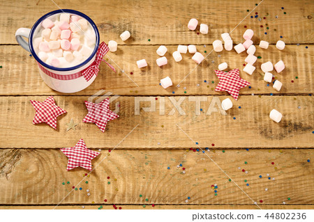 christmas chocolate with marshmallows and gingerbreads on an old wooden table 44802236