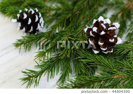Christmas fir tree branches on white wooden  44804300