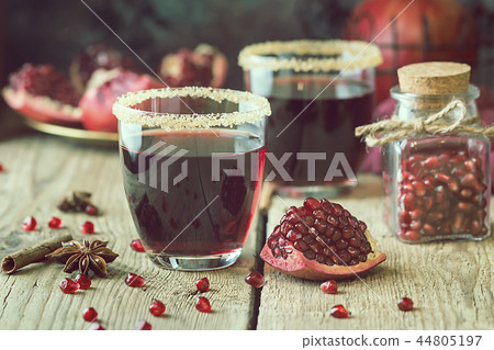 A glass of pomegranate juice A glass of pomegranate juice 44805197