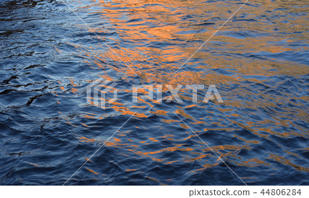 Water with waves by evening. 44806284