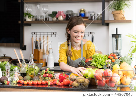 Woman with fruits and vegetables 44807043