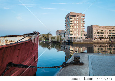 Modern buildings and vessel in the city Rostock Modern buildings and vessel in the city Rostock 44807583