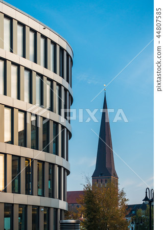 Modern building and church in the city Rostock Modern building and church in the city Rostock 44807585