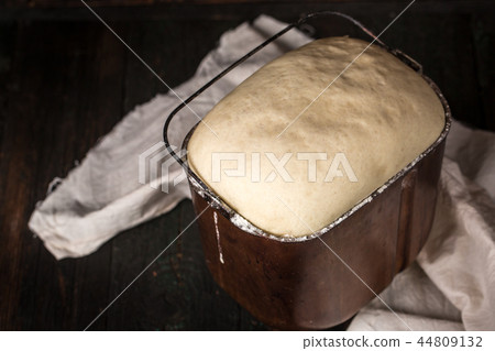 dough rises in the bowl, top view dough rises in the bowl, top view 44809132