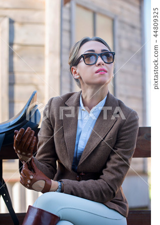 Woman in a jacket and gloves 44809325