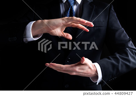 Man holding his hands out and showing something 44809427
