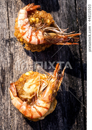 Shrimp on chickpea cutlets Shrimp on chickpea cutlets 44810503