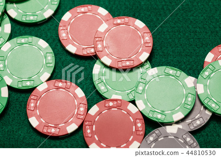 Casino chips on green table 44810530