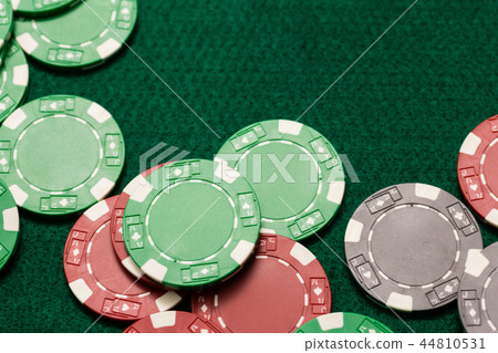 Casino chips on green table 44810531