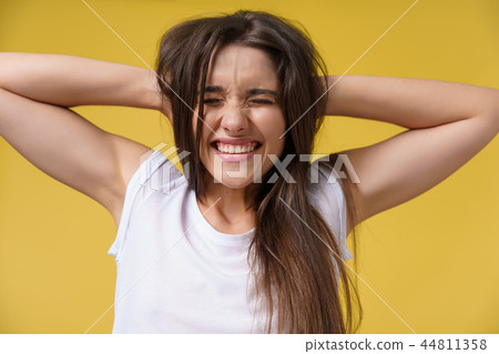 Portrait of shocked scared young woman in casual white shirt hearing bad news with disgusting 44811358