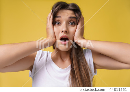 Portrait of shocked scared young woman in casual white shirt hearing bad news with disgusting 44811361