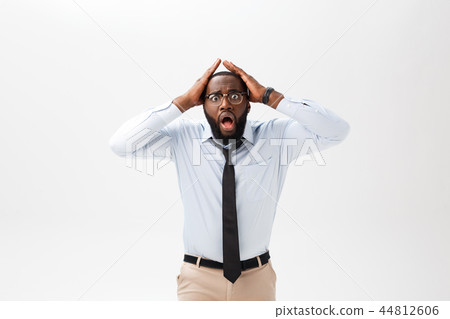 African American businessman doing surprise gesture on white background African American businessman doing surprise gesture on white background 44812606