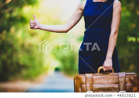 young woman with suitcase young woman with suitcase 44813821