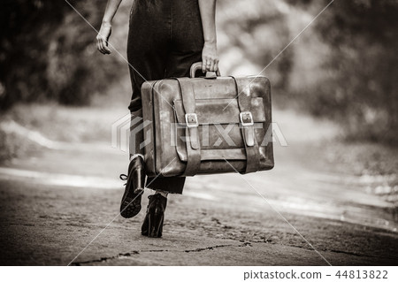 young woman with suitcase 44813822