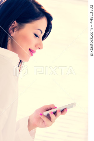 young woman with mobile phone young woman with mobile phone 44813832