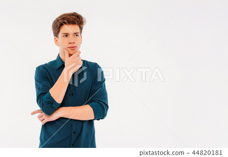 Pensive teenager student on white background Pensive teenager student on white background 44820181