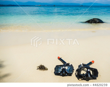 Two snorkell mask on a white sandy beach 44820239