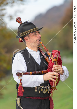 Typical player in traditional northern Italy bagpipe Typical player in traditional northern Italy bagpipe 44822645