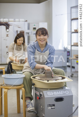 A woman doing ceramics A woman doing ceramics 44823452