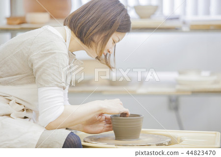 A woman doing ceramics A woman doing ceramics 44823470