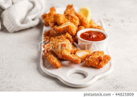 Fried Breaded chicken with tomato sauce Fried Breaded chicken with tomato sauce 44823809