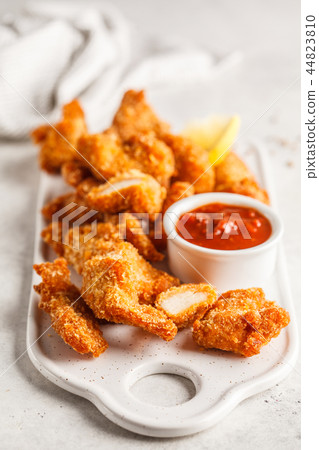 Fried Breaded chicken with tomato sauce Fried Breaded chicken with tomato sauce 44823810