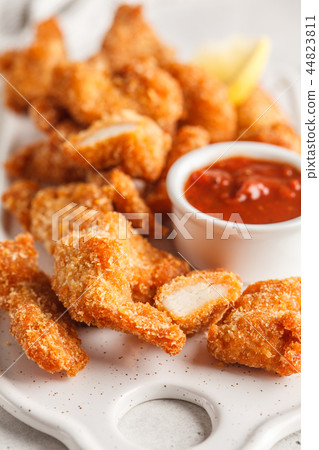 Fried Breaded chicken with tomato sauce Fried Breaded chicken with tomato sauce 44823811