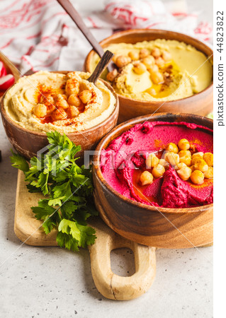 Chickpea hummus, avocado hummus and beet hummus Chickpea hummus, avocado hummus and beet hummus 44823822