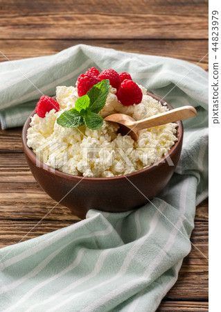 Fresh cottage cheese with raspberries  44823979