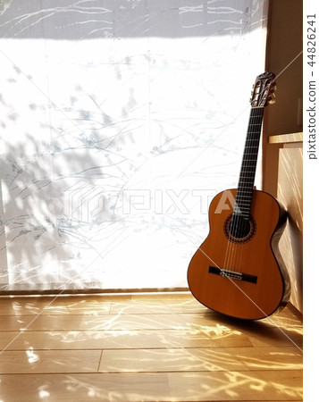Guitar in a calm sunshine Guitar in a calm sunshine 44826241