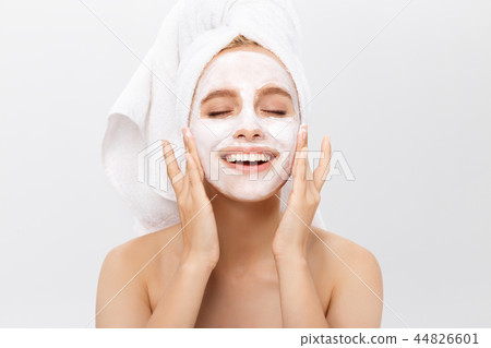 Beautiful woman with facial mask on white background 44826601