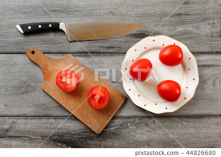 Table top view on three tomatoes on plate Table top view on three tomatoes on plate 44826680