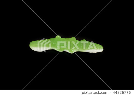 jelly candies in the crocodile shape on a black background. 44826776