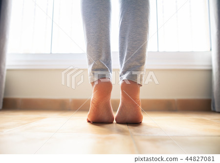 Woman bare feet walking on floor Woman bare feet walking on floor 44827081