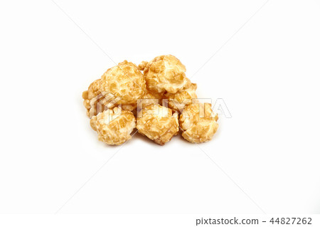 Pile of caramel popcorn on white background. 44827262