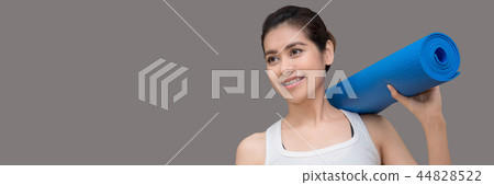 Young asian woman holding her yoga mat Young asian woman holding her yoga mat 44828522